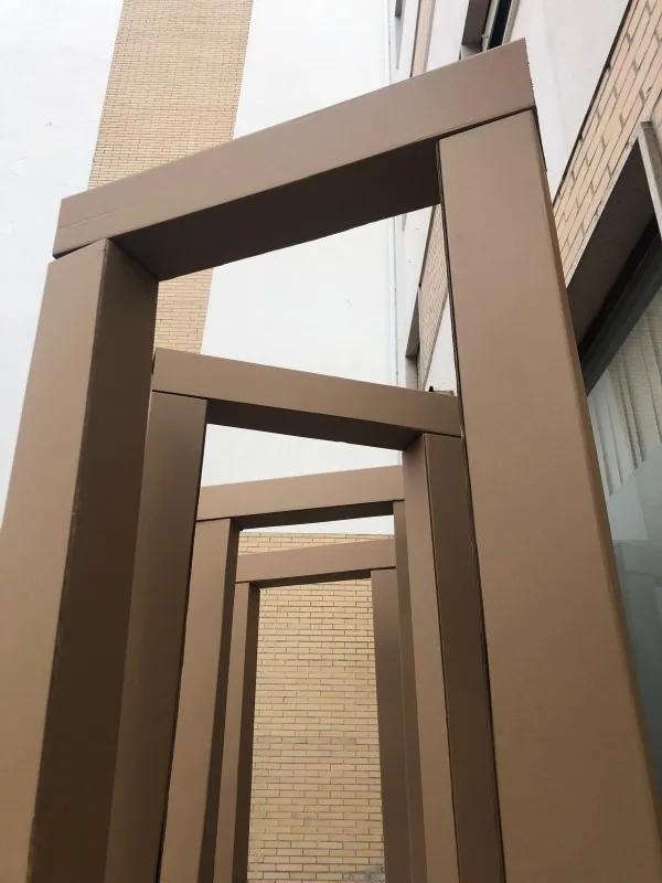 To Be Stoic, 2024. Installation composed of four porticoes, cardboard, 216 × 100 × 16 cm.